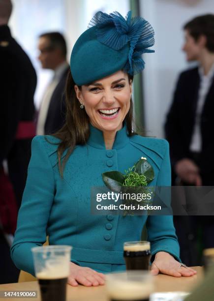 Catherine, Princess of Wales enjoys a glass of Guinness during the St. Patrick's Day Parade at Mons Barracks on March 17, 2023 in Aldershot, England....