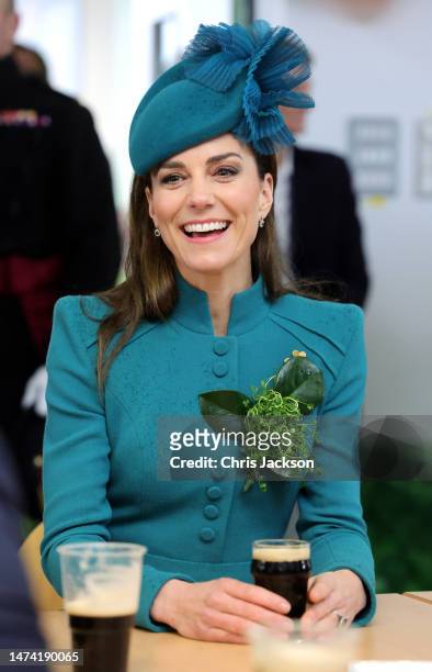 Catherine, Princess of Wales enjoys a glass of Guinness during the St. Patrick's Day Parade at Mons Barracks on March 17, 2023 in Aldershot, England....