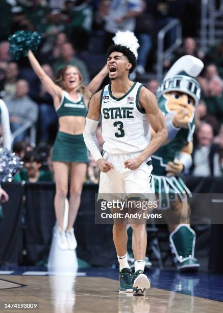Jaden Akins of the Michigan State Spartans celebrates a basket against the USC Trojans during the second half in the first round game of the NCAA...