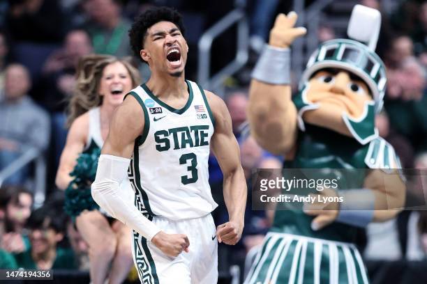 Jaden Akins of the Michigan State Spartans celebrates a basket against the USC Trojans during the second half in the first round game of the NCAA...