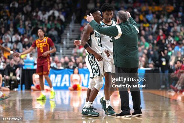 Head coach Tom Izzo of the Michigan State Spartans hugs Tyson Walker and Jaden Akins against the USC Trojans during the second half in the first...