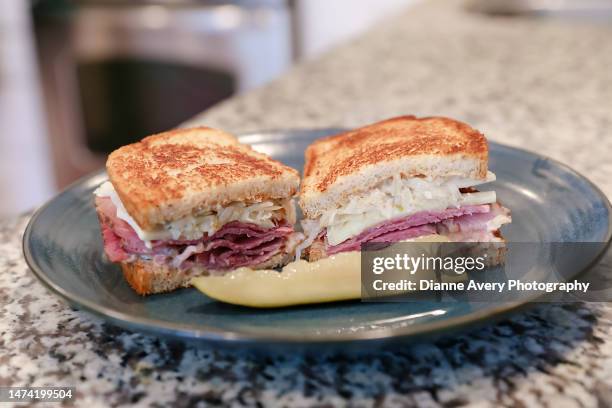 rueben sandwich and a pickle - rye - grain stock pictures, royalty-free photos & images