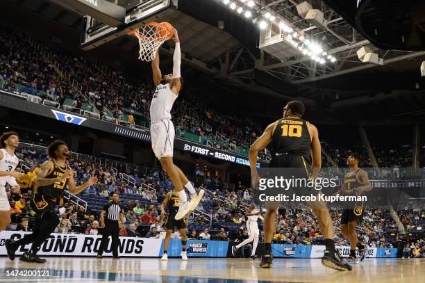 Jerome Hunter of the Xavier Musketeers dunks against the Kennesaw State Owls during the first half in the first round of the NCAA Men's Basketball...