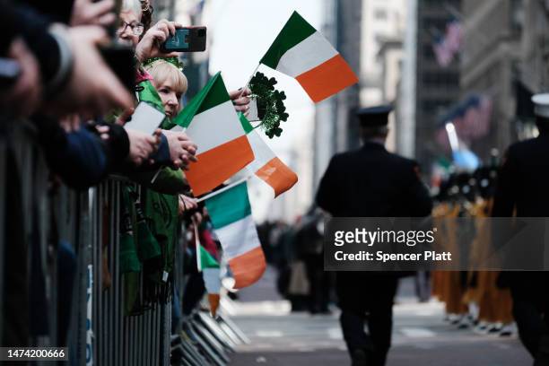 People watch the St. Patrick's Day Parade along 5th Ave. On March 17, 2023 in New York City. Known as the world's largest St. Patrick's Day Parade,...