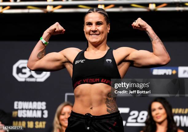 Jennifer Maia of Brazil poses on the scale during the UFC 286 ceremonial weigh-in at The O2 Arena on March 17, 2023 in London, England.