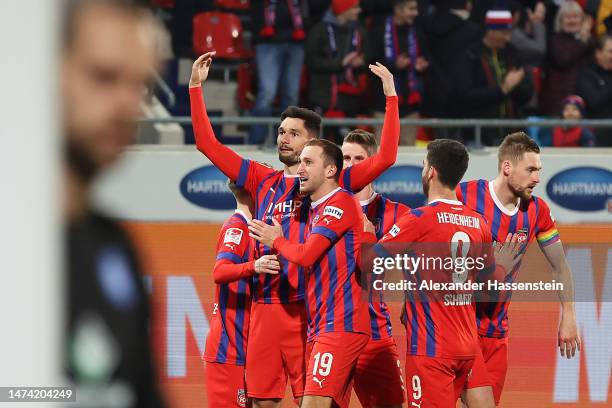 Tim Kleindienst of 1. FC Heidenheim 1846 celebrates with teammates after scoring the team's third goal during the Second Bundesliga match between 1....