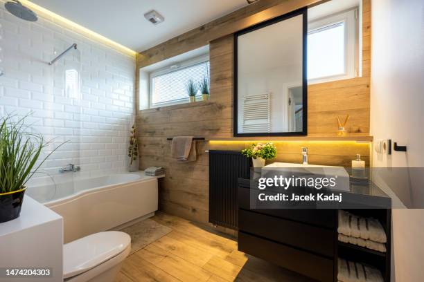 modern small bathroom in stylish apartment - bathroom stock pictures, royalty-free photos & images