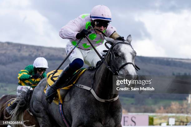 Jockey, Paul Townend on Lossiemouth competes in the JCB Triumph Hurdle race during day four, Gold Cup Day, of the Cheltenham Festival 2023 at...