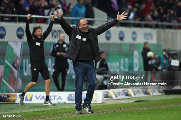 Frank Schmidt, Head Coach of 1. FC Heidenheim celebrates their team's fifth goal, scored by Kevin Sessa during the Second Bundesliga match between 1....