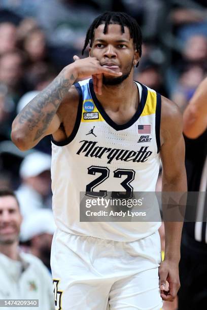 David Joplin of the Marquette Golden Eagles celebrates a basket against the Vermont Catamounts during the first half in the first round game of the...