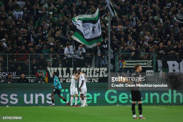 Florian Neuhaus of Borussia Moenchengladbach celebrates with team mates after scoring the team's second goal during the Bundesliga match between...