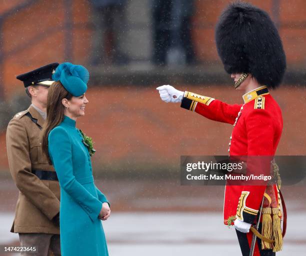 Catherine, Princess of Wales presents traditional sprigs of shamrock to Officers and Guardsmen of the Irish Guards as she attends the 2023 St....