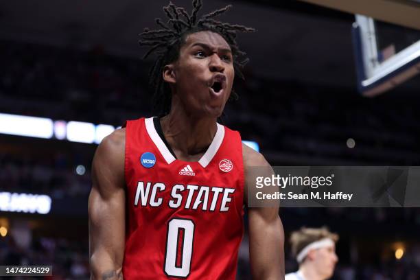 Terquavion Smith of the North Carolina State Wolfpack reacts after a dunk during the second half against the Creighton Bluejays in the first round of...