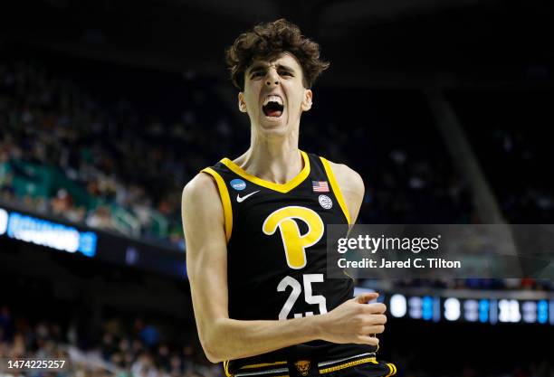 Guillermo Diaz Graham of the Pittsburgh Panthers celebrates after dunking against the Iowa State Cyclones during the second half in the first round...