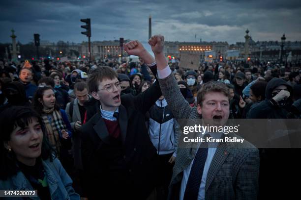 Protesters chant at Place de la Concorde as demonstrations continue for a second straight night against the French Government's pension reform on...