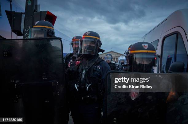 France Riot Police face protestors and block the road to the National Assembly as demonstrations continue for a second straight night at Place de la...