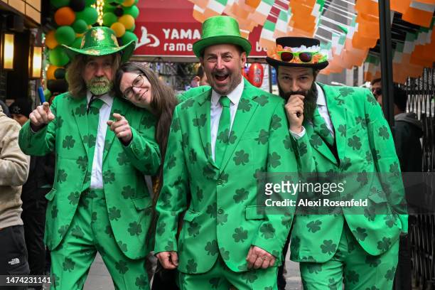 Three men wearing matching green suits pose near the St. Patrick’s Day parade on March 17, 2023 in New York City. The annual New York City St....
