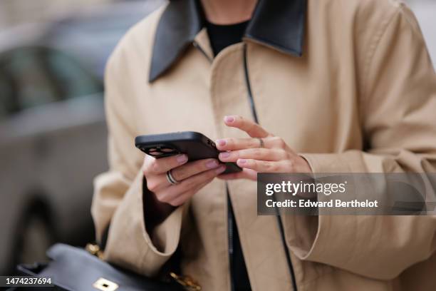 Diane Batoukina wears a beige coat, during a street style fashion photo session, on March 17, 2023 in Paris, France.