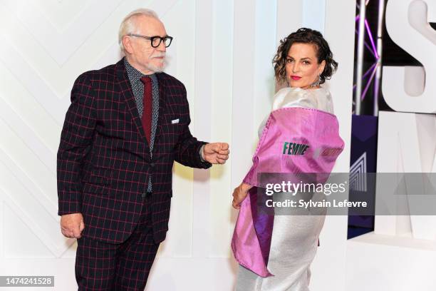 Brian Cox and Nicole Ansari-Cox, who wears a scarf reading the slogan "Woman, life, freedom" in support of the women of Iran, attend the opening...