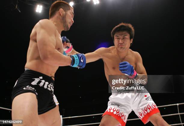 Takanori Gomi punches Hayato Sakurai in the Pride Grand Prix finals inside Saitama Super Arena on December 31, 2005 in Saitama, Japan.