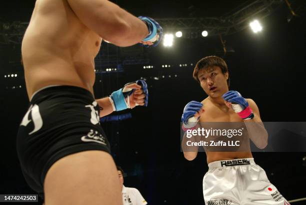 Takanori Gomi battles Hayato Sakurai in the Pride Grand Prix finals inside Saitama Super Arena on December 31, 2005 in Saitama, Japan.