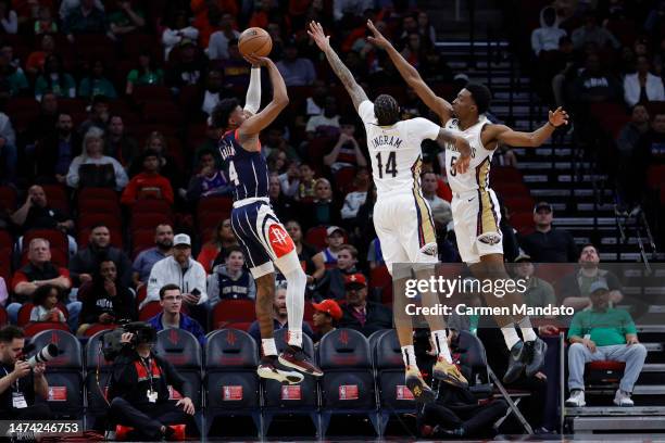 Jalen Green of the Houston Rockets shoots a basket ahead of Brandon Ingram of the New Orleans Pelicans during the first half at Toyota Center on...