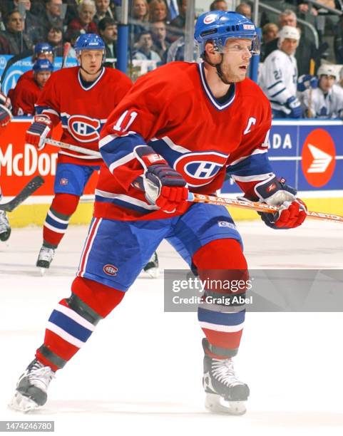 Saku Koivu of the Montreal Canadiens skates against the Toronto Maple Leafs during NHL game action on February 8, 2003 at Air Canada Centre in...