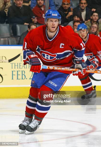 Saku Koivu of the Montreal Canadiens skates against the Toronto Maple Leafs during NHL game action on February 8, 2003 at Air Canada Centre in...