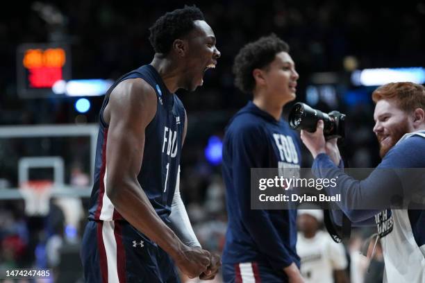 Joe Munden Jr. #1 of the Fairleigh Dickinson Knights celebrates after beating the Purdue Boilermakers 63-58 in the first round of the NCAA Men's...