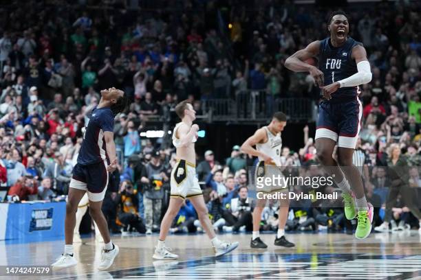 Joe Munden Jr. #1 of the Fairleigh Dickinson Knights celebrates after beating the Purdue Boilermakers 63-58 in the first round of the NCAA Men's...