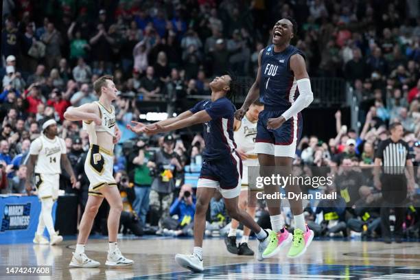 Joe Munden Jr. #1 of the Fairleigh Dickinson Knights celebrates after beating the Purdue Boilermakers 63-58 in the first round of the NCAA Men's...