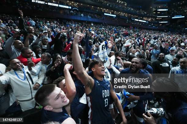 Jo'el Emanuel of the Fairleigh Dickinson Knights celebrates with the crowd after beating the Purdue Boilermakers 63-58 in the first round of the NCAA...