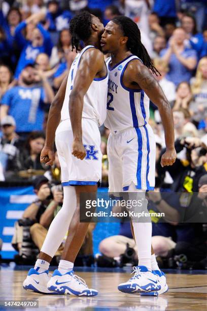 Antonio Reeves and Cason Wallace of the Kentucky Wildcats celebrate after defeating the Providence Friars 61-53 in the first round of the NCAA Men's...