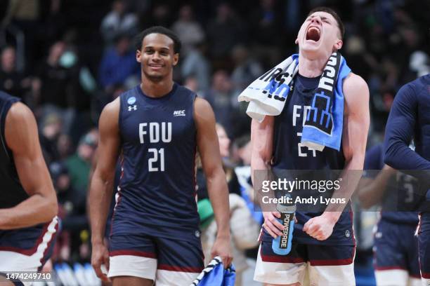 Cameron Tweedy and Brayden Reynolds of the Fairleigh Dickinson Knights celebrate after beating the Purdue Boilermakers 63-58 in the first round of...