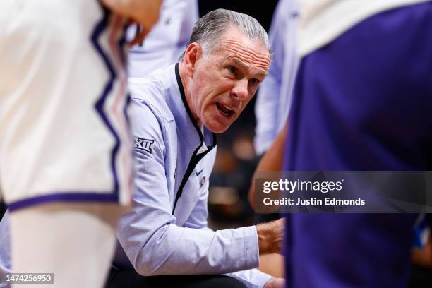 Head coach Jamie Dixon of the TCU Horned Frogs instructs his team during a timeout against the Arizona State Sun Devils during the first half in the...