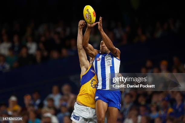 Aiden Bonar of the Kangaroos and Callum Jamieson of the Eagles contest the ball during the round one AFL match between North Melbourne Kangaroos and...