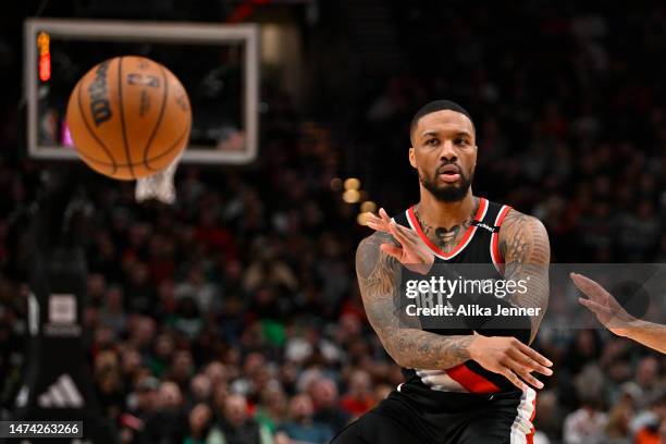 Damian Lillard of the Portland Trail Blazers passes the ball during the second quarter against the Boston Celtics at the Moda Center on March 17,...