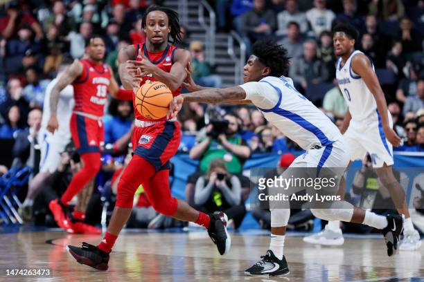 Kendric Davis of the Memphis Tigers reaches for the ball during the second half of a game against the Florida Atlantic Owls in the first round of the...