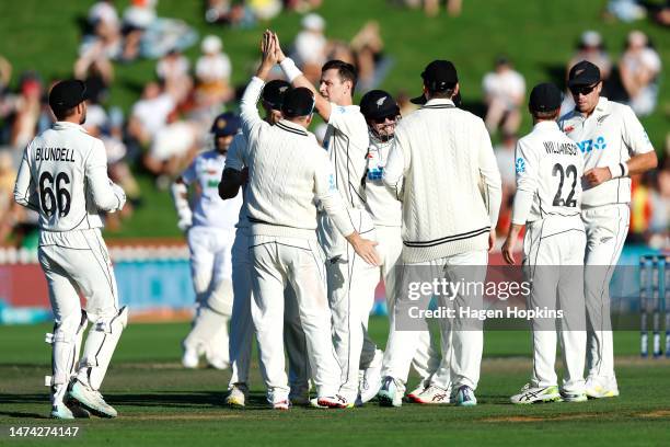 Matt Henry of New Zealand celebrates with teammates after taking the wicket of Oshada Fernando of Sri Lanka during day two of the Second Test Match...