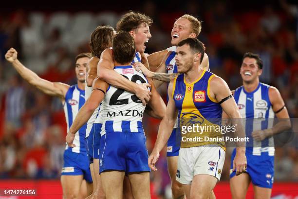 Nick Larkey of the Kangaroos celebrates kicking a goal during the round one AFL match between North Melbourne Kangaroos and West Coast Eagles at...