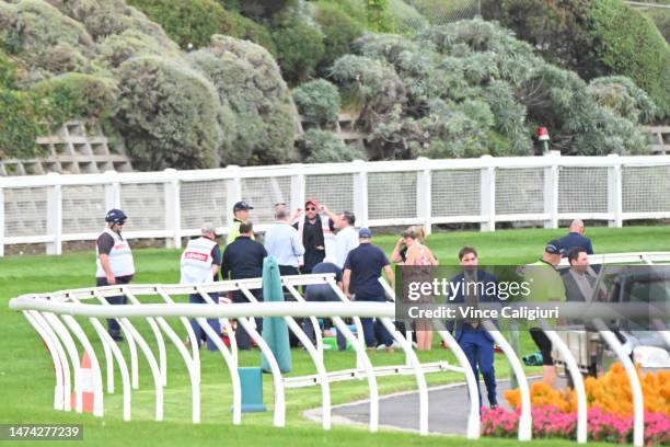 Teodore Nugent is being attended to by medical staff after falling in Race 6, the Entry Education Abell Stakes, during Melbourne Racing at Moonee...