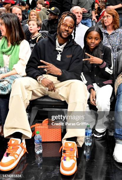Rapper 2 Chainz and Harmony Epps attend the game between the Golden State Warriors and the Atlanta Hawks at State Farm Arena on March 17, 2023 in...