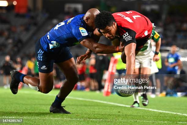 Leicester Fainga'anuku of the Crusaders dives over to score a try during the round four Super Rugby Pacific match between Blues and Crusaders at Eden...