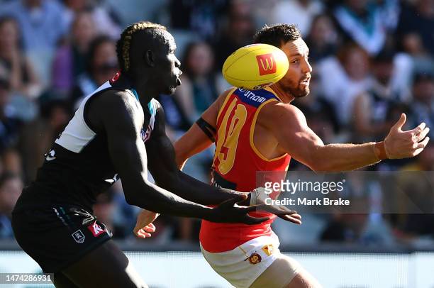 Aliir Aliir of Port Adelaide marks over Jack Gunston of the Lions during the round one AFL match between Port Adelaide Power and Brisbane Lions at...