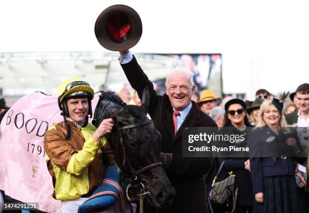 Paul Townend poses alongside Trainer Willie Mullins after winning the Boodles Cheltenham Gold Cup Chase on board Galopin Des Champs during day four...