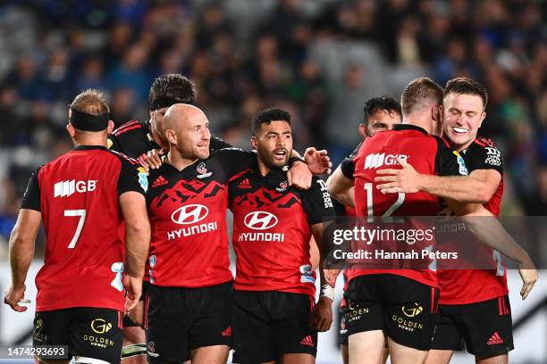 Willi Heinz and Richie Mo'unga of the Crusaders celebrate after winning the round four Super Rugby Pacific match between Blues and Crusaders at Eden...