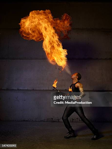 fire breeder - fire performer stock pictures, royalty-free photos & images