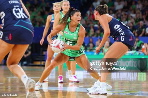 Verity Simmons of the fever looks down the court for a passing option during the round one Super Netball match between West Coast Fever and Melbourne...