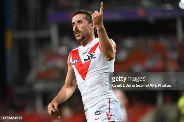 Jake Lloyd of the Swans celebrates a goal during the round one AFL match between Gold Coast Suns and Sydney Swans at Heritage Bank Stadium, on March...