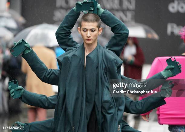 Model walks the runway during the docomo x RequaL≡ show during Rakuten Fashion Week TOKYO 2023 A/W on March 18, 2023 in Tokyo, Japan.